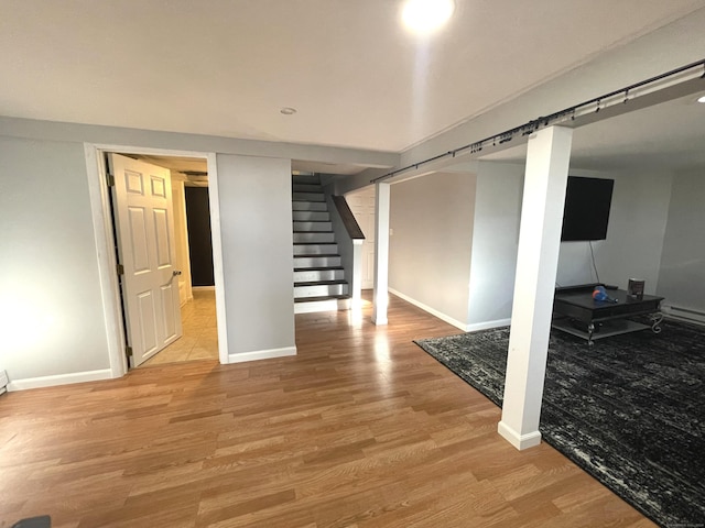 basement featuring light hardwood / wood-style flooring