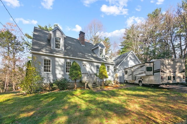 back of house with a lawn