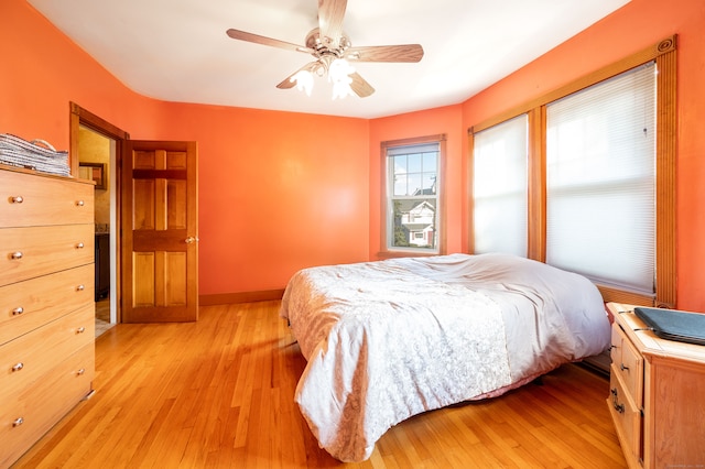 bedroom featuring light wood-type flooring and ceiling fan