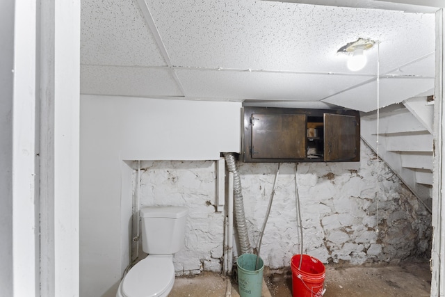 basement with a paneled ceiling