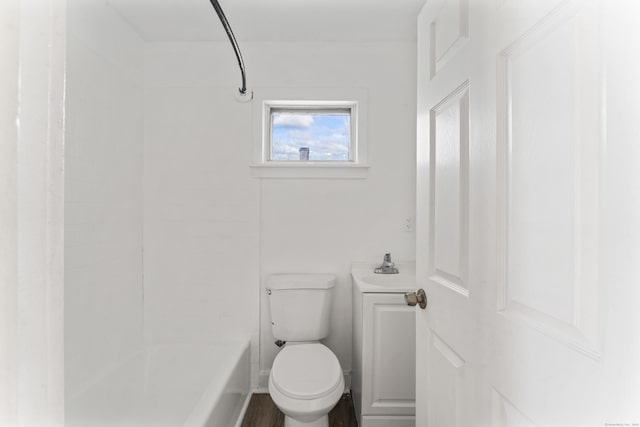 bathroom with toilet, shower / bath combination, and wood-type flooring