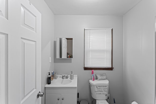 bathroom with vanity and toilet