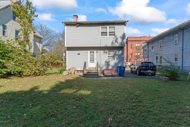 back of house with a yard