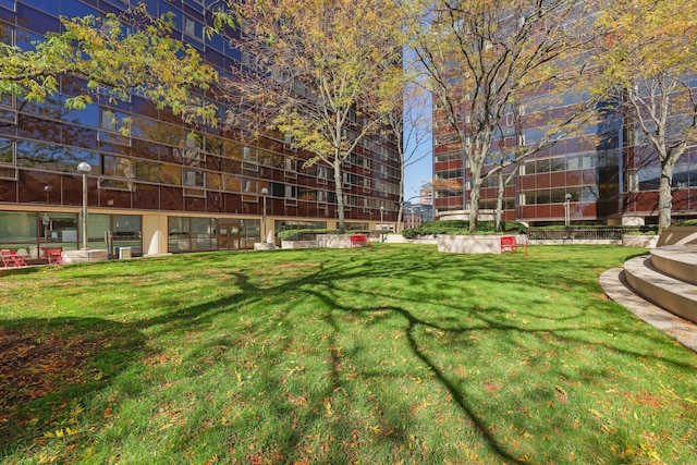 view of property's community featuring a yard