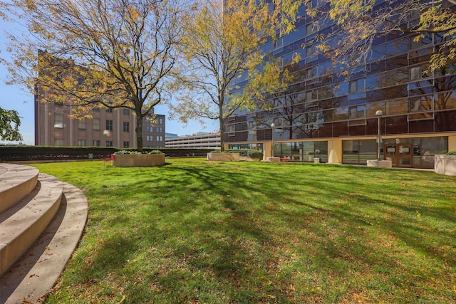 view of home's community featuring a lawn