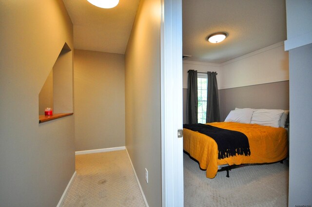 carpeted bedroom featuring a textured ceiling