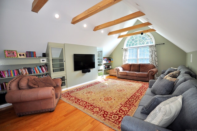 living room with lofted ceiling with beams and hardwood / wood-style floors