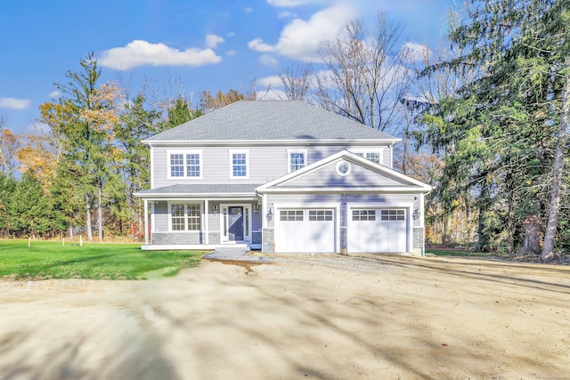 view of front facade featuring a front yard and a garage