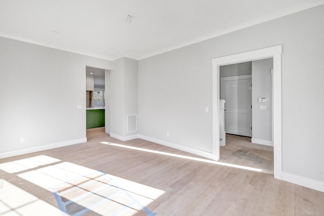 unfurnished room featuring light hardwood / wood-style floors