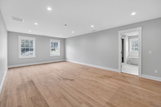 spare room featuring light hardwood / wood-style flooring