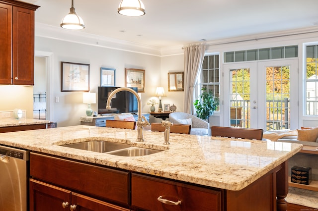 kitchen featuring stainless steel dishwasher, ornamental molding, sink, and hanging light fixtures