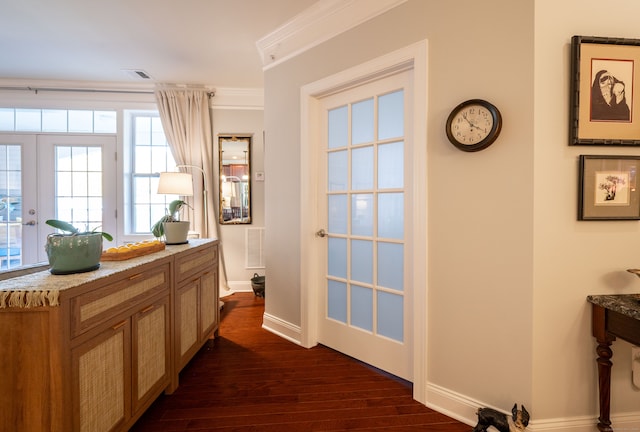 interior space featuring dark wood-type flooring, crown molding, and french doors