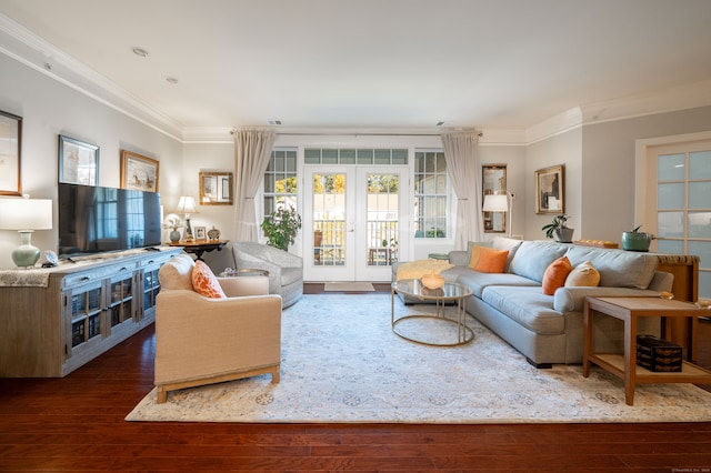 living room with french doors, crown molding, and dark hardwood / wood-style flooring