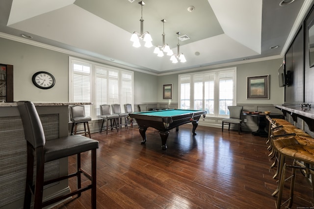 rec room with pool table, ornamental molding, dark wood-type flooring, and a raised ceiling