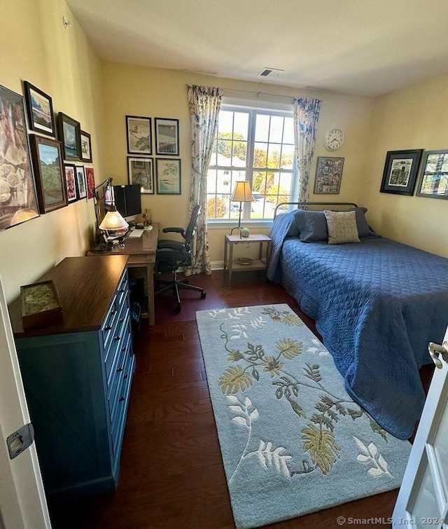 bedroom featuring dark wood-type flooring