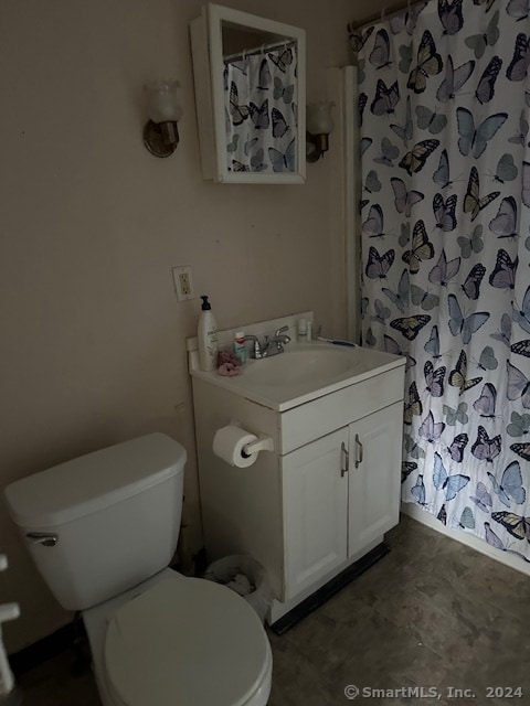 bathroom with vanity and toilet