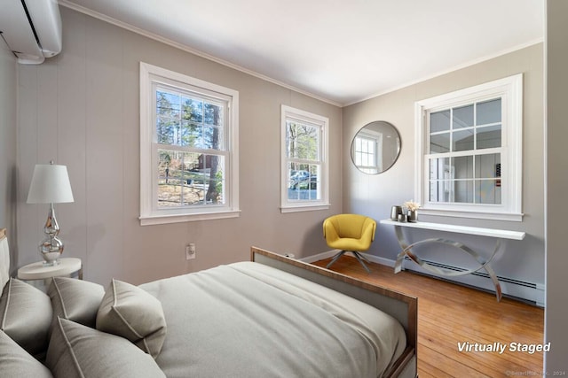 bedroom featuring a baseboard radiator, hardwood / wood-style floors, a wall mounted AC, and ornamental molding