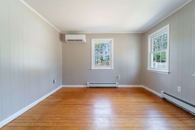 empty room featuring an AC wall unit, crown molding, light hardwood / wood-style floors, and baseboard heating