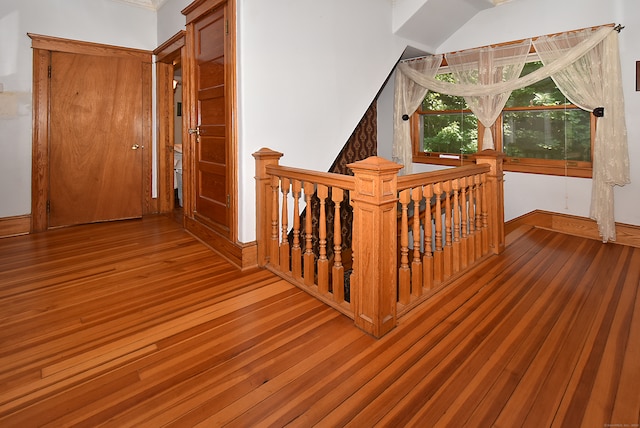 stairway with hardwood / wood-style flooring