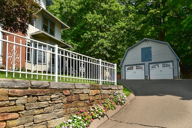 view of home's exterior with an outbuilding and a garage