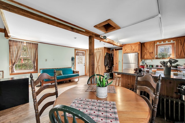 dining area with light wood-type flooring