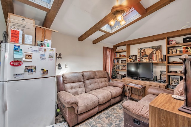 living room with beamed ceiling and a skylight