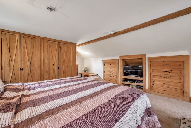 carpeted bedroom featuring lofted ceiling with beams