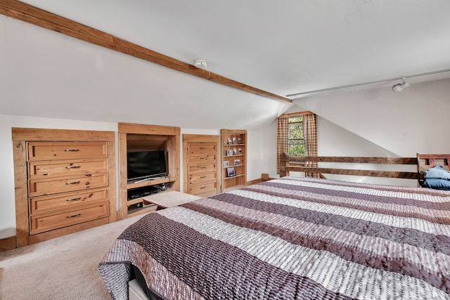 bedroom with carpet flooring and vaulted ceiling