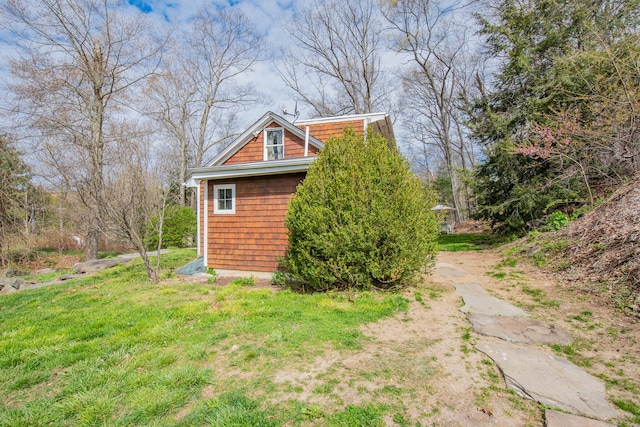 view of outdoor structure with a lawn