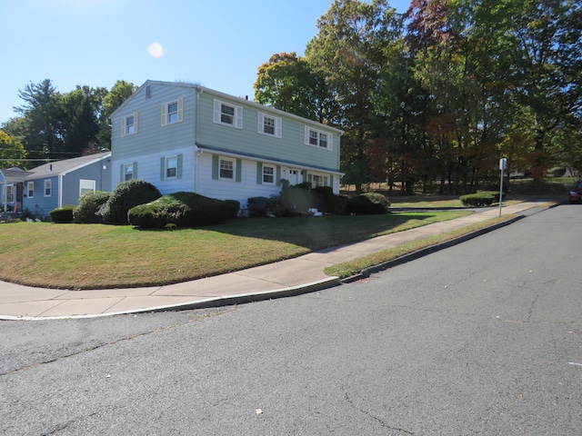 view of front facade featuring a front yard