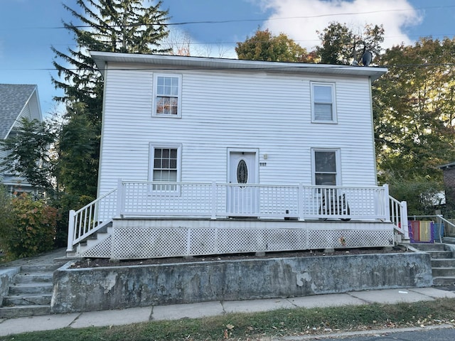 view of front of property featuring a wooden deck