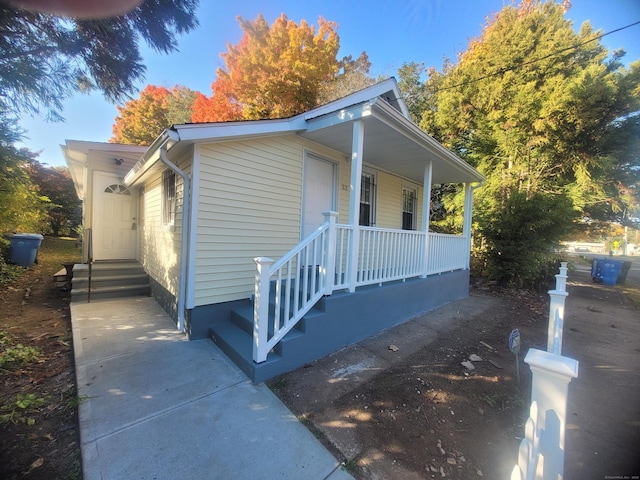 view of side of property with a porch