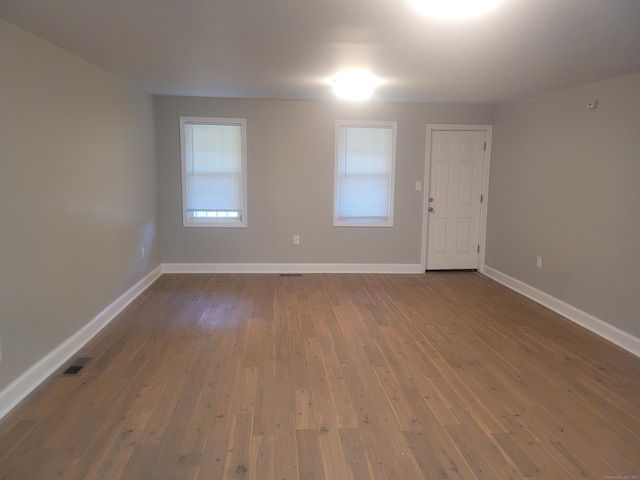 empty room featuring hardwood / wood-style floors