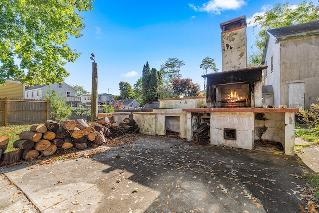 view of patio / terrace featuring exterior fireplace