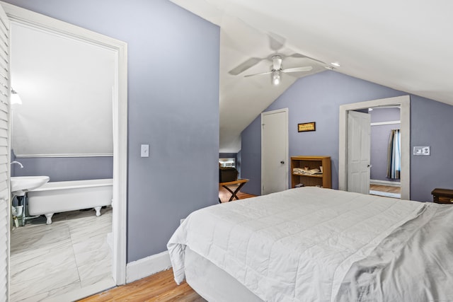 bedroom featuring hardwood / wood-style floors, ceiling fan, and vaulted ceiling