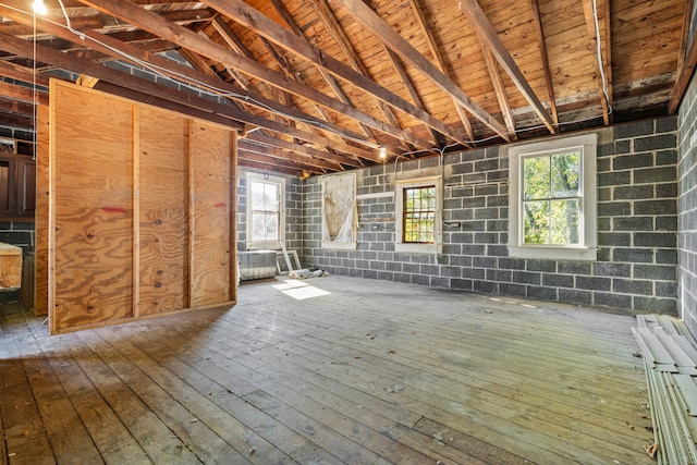 miscellaneous room with hardwood / wood-style floors, vaulted ceiling with beams, a wealth of natural light, and wood ceiling