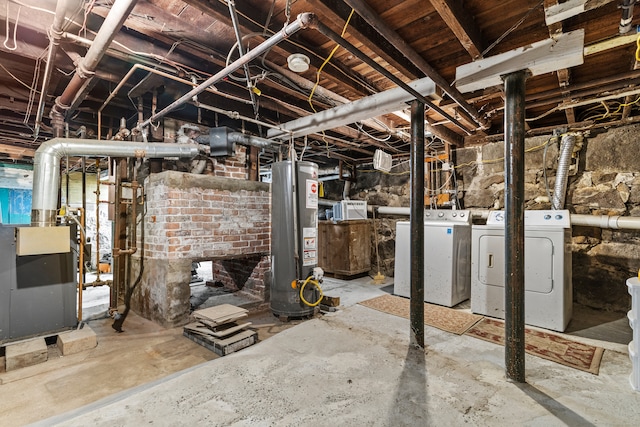 basement featuring washer and dryer and gas water heater