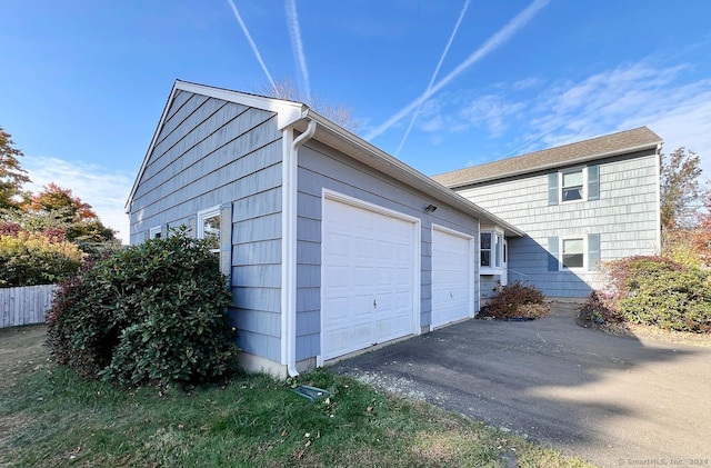 view of side of property with a garage