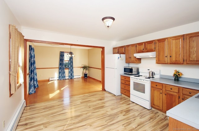 kitchen with baseboard heating, hanging light fixtures, white appliances, and light hardwood / wood-style floors