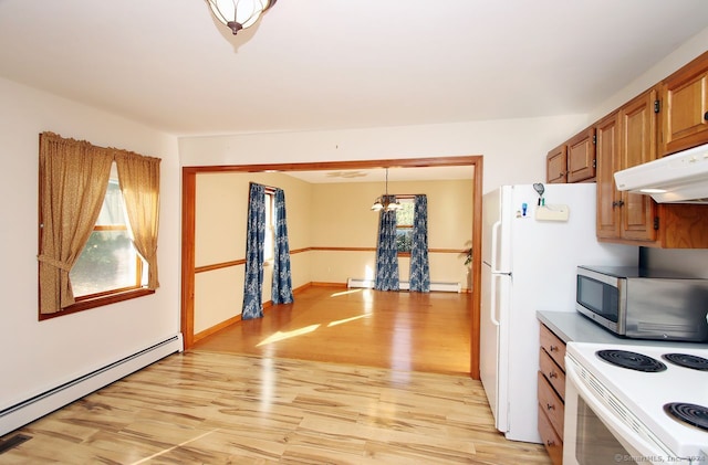 kitchen featuring white electric range oven, light wood-type flooring, a baseboard radiator, and hanging light fixtures