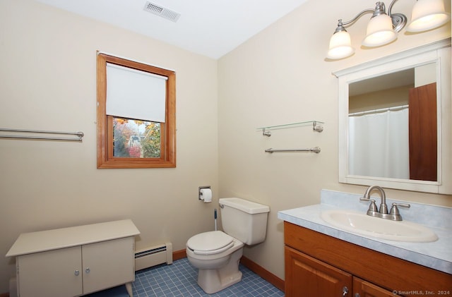 bathroom featuring baseboard heating, tile patterned flooring, vanity, and toilet