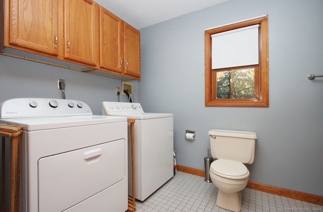 laundry room featuring independent washer and dryer and light tile patterned floors