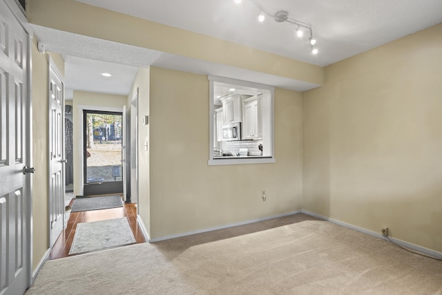 view of carpeted foyer