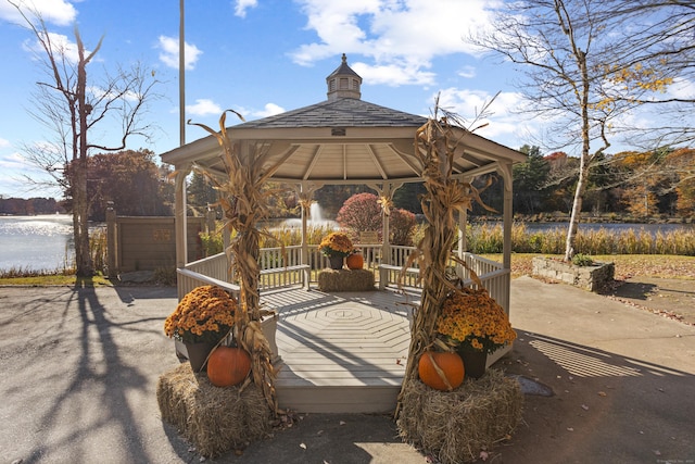 view of home's community featuring a gazebo and a water view