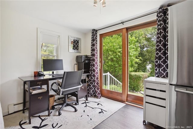 office featuring a baseboard radiator and dark hardwood / wood-style floors