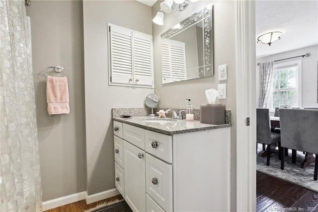 bathroom featuring hardwood / wood-style floors and vanity