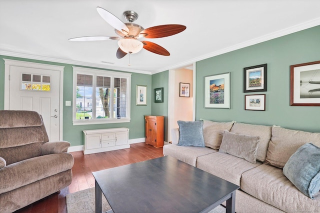 living area with baseboards, ornamental molding, ceiling fan, and hardwood / wood-style floors