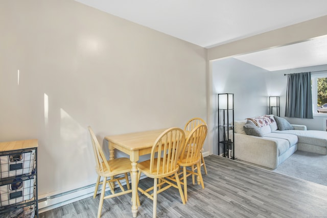 dining area with wood-type flooring