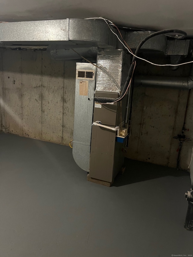 basement featuring heating unit