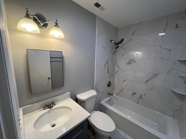 full bathroom featuring toilet, tiled shower / bath combo, and vanity